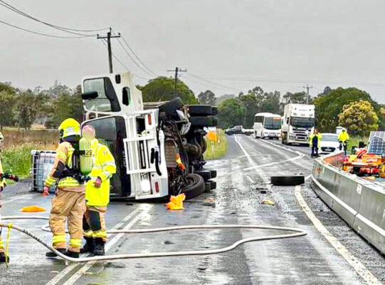 UPDATE: Driver in his 20s has minor injuries after truck rolls on highway