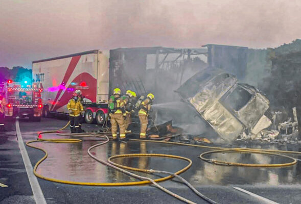 UPDATE: Two trucks crash, one destroyed by fire as cleanup continues